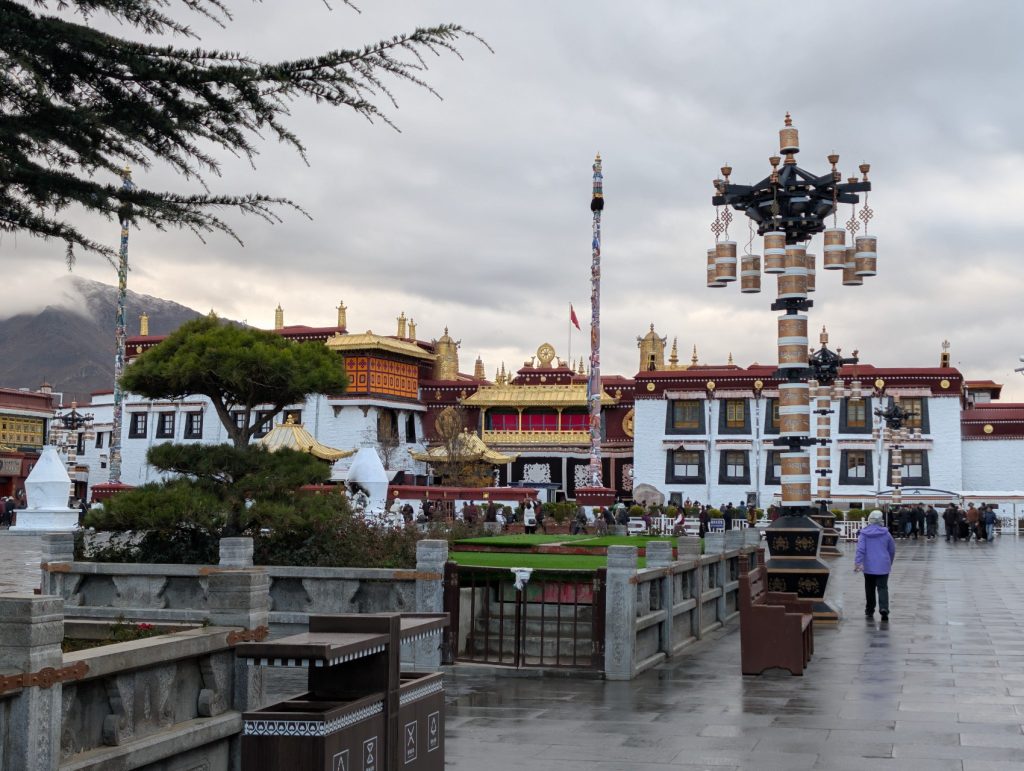 Early pilgrims performing their morning prayers at Barkhor Street around Jokhang Temple