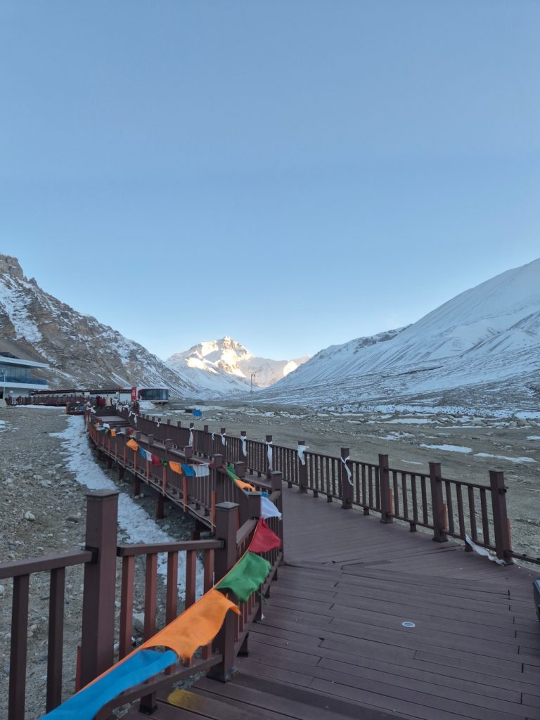 Wooden boardwalk at Everest Base Camp with strong winds