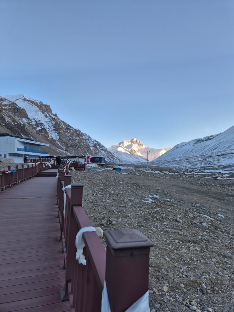 Wooden boardwalk at Everest Base Camp with strong winds
