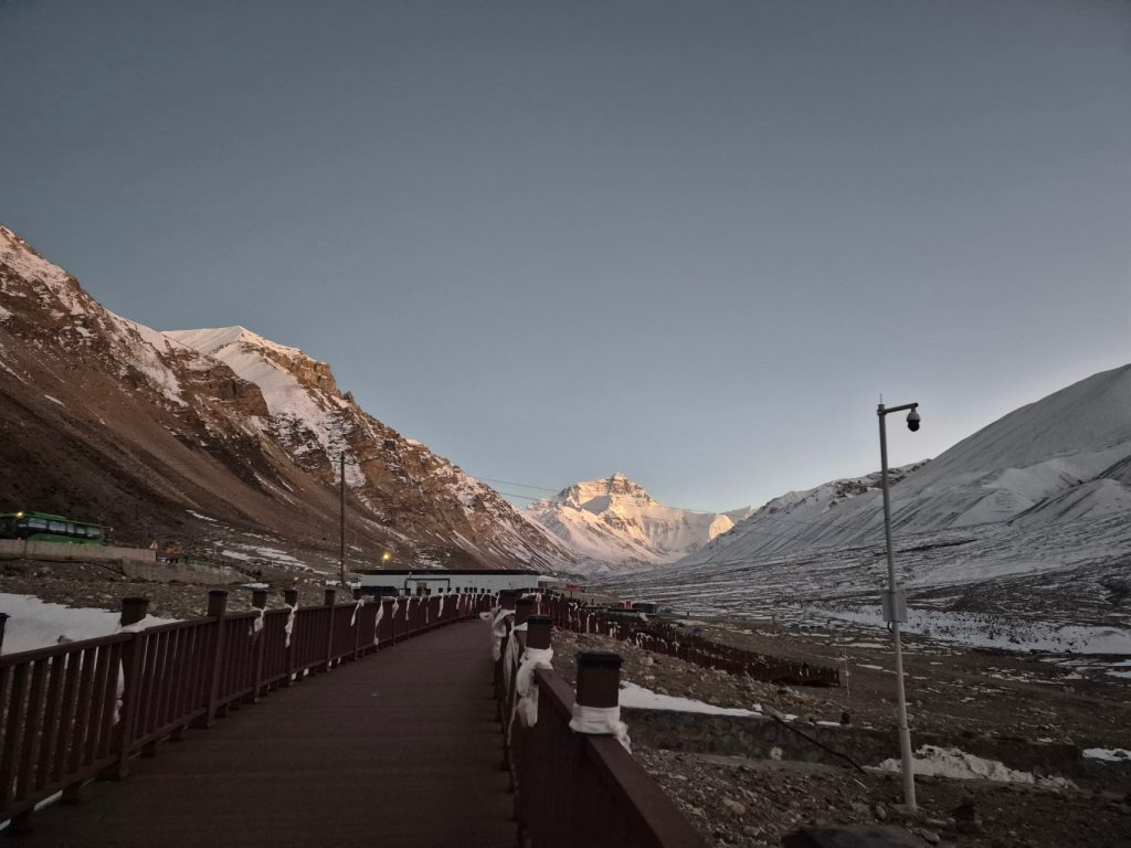 Wooden boardwalk at Everest Base Camp with strong winds