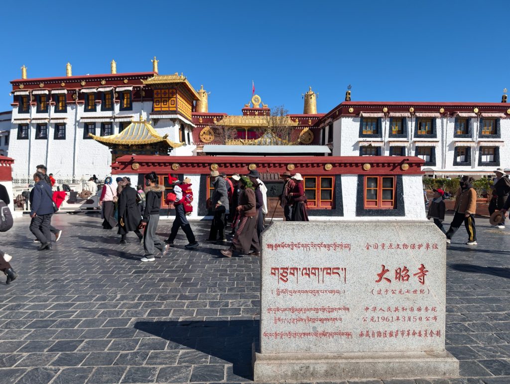 Pilgrims performing kora around Jokhang Temple