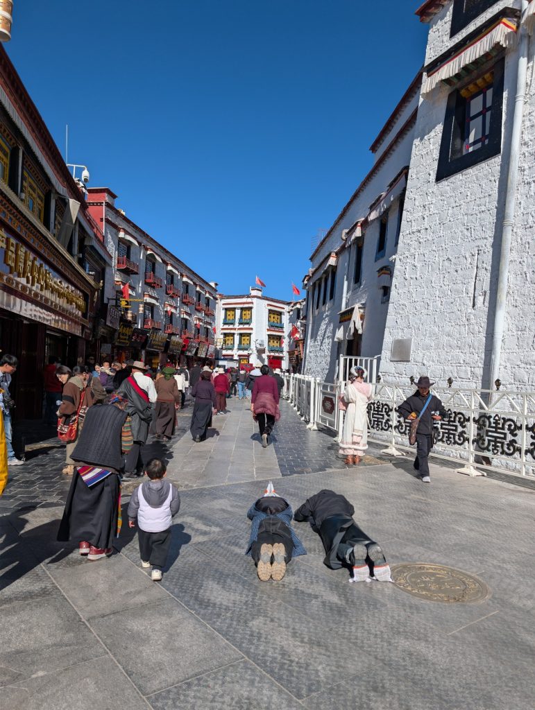 Pilgrims performing kora around Jokhang Temple