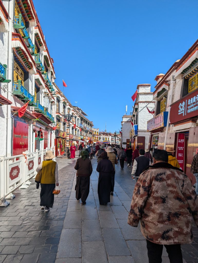 Pilgrims performing kora around Jokhang Temple